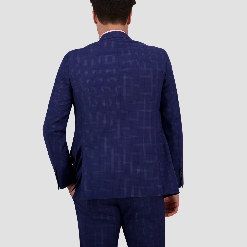 Azure blue merino wool patterned suit by Savile Row, double vented, with a pink shirt, and matching pants.