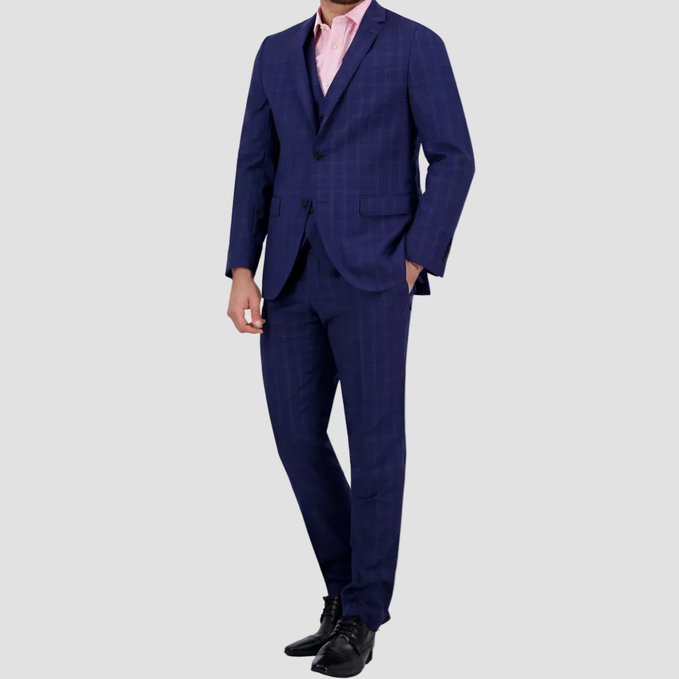 Azure blue merino wool patterned suit by Savile Row with a pink shirt, and matching vest and pants, finished with black leather shoes.
