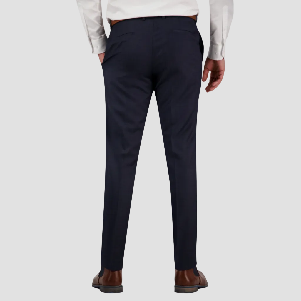 Navy dress pants in Australian merino wool by Savile Row worn with a white shirt and brown leather belt and boots.
