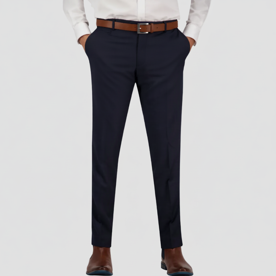 Navy dress pants in Australian merino wool by Savile Row worn with a white shirt and brown leather belt and boots.