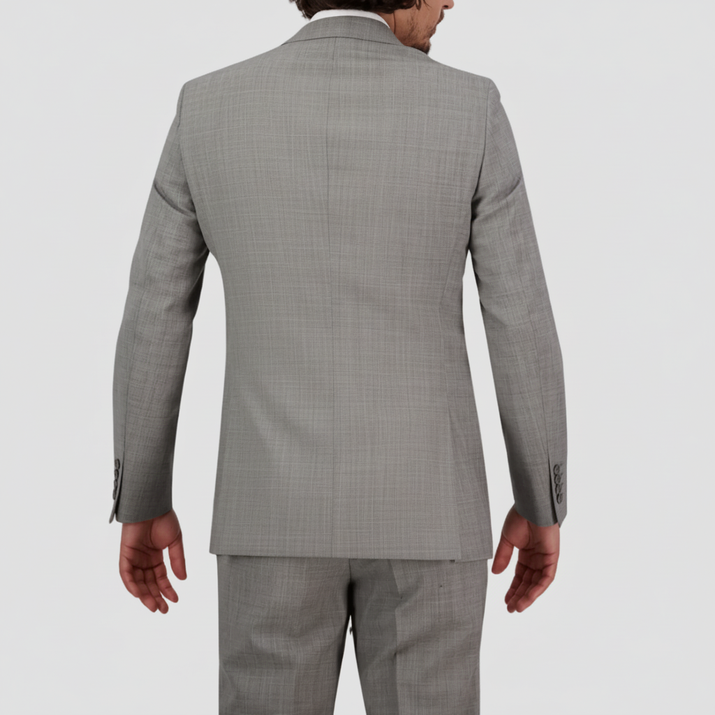 Chrome tailored suit in a refined wool blend with performance finish by Savile Row. 