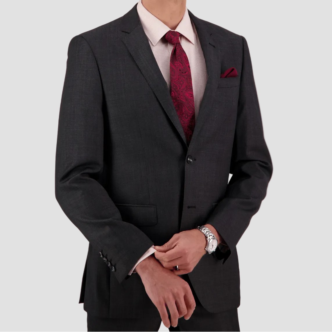 A tailored charcoal textured suit in Super 110’s Merino by Savile Row for comfort and polish.
