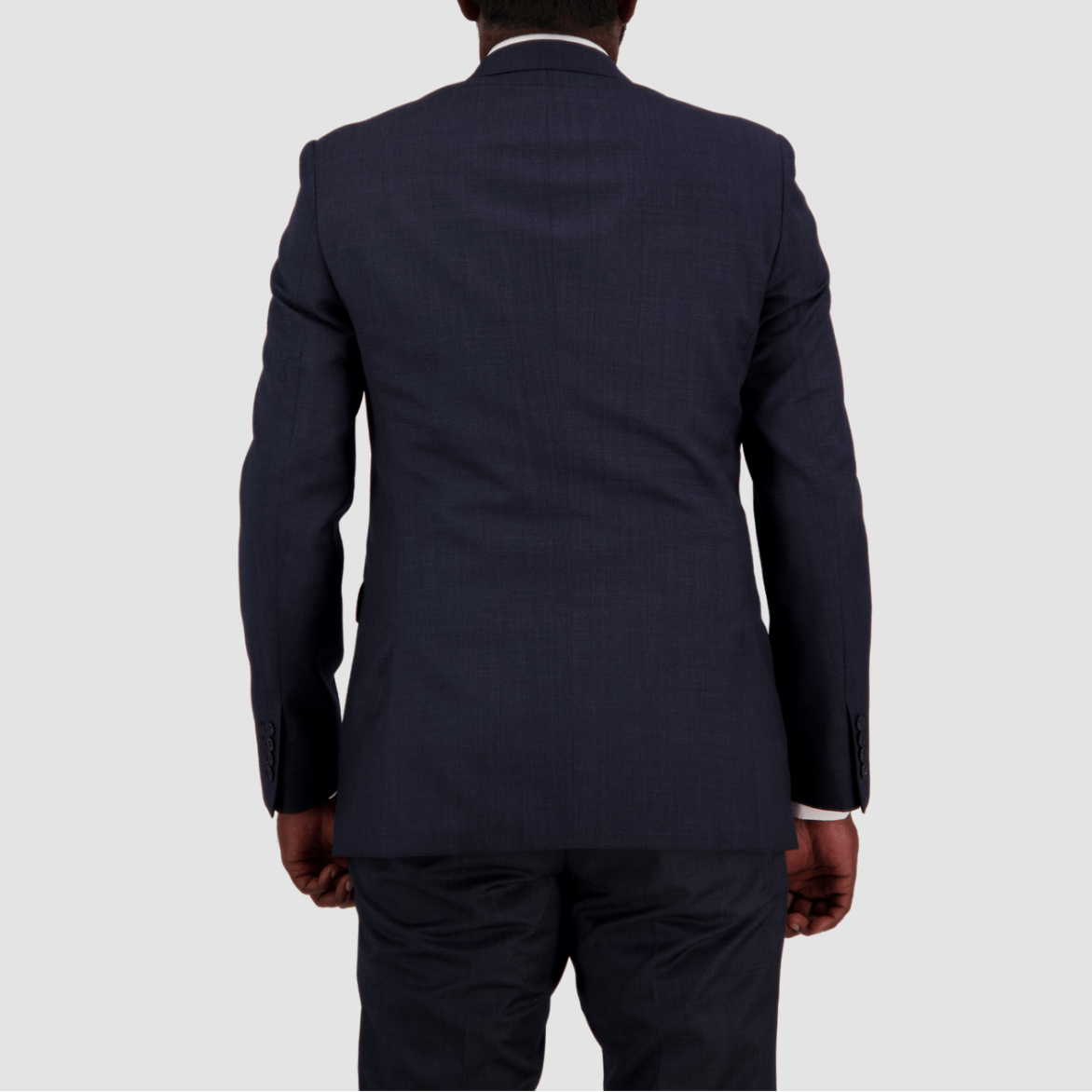 Tailored navy wool suit for big men by Savile Row, crafted in Super 110’s Merino with a refined Euro finish, with a white shirt, blue patterned tie and pocket square.