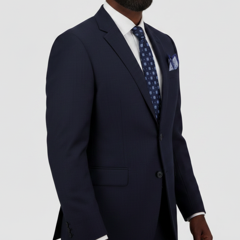 Tailored navy wool suit for big men by Savile Row, crafted in Super 110’s Merino with a refined Euro finish, with a white shirt, blue patterned tie and pocket square.