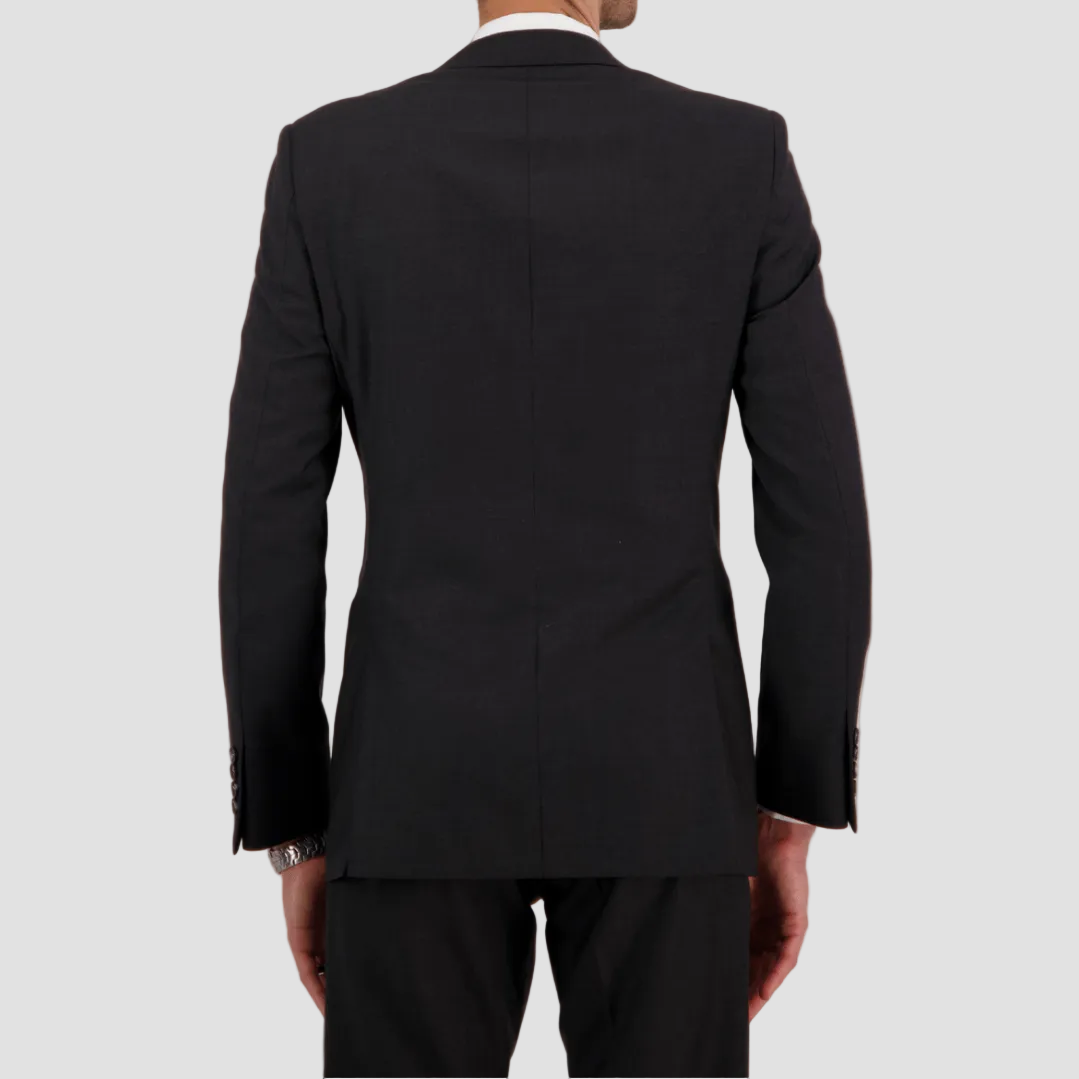 Charcoal travel‑finish wool suit by Savile Row, tailored in Super 110’s Merino for structure and ease.