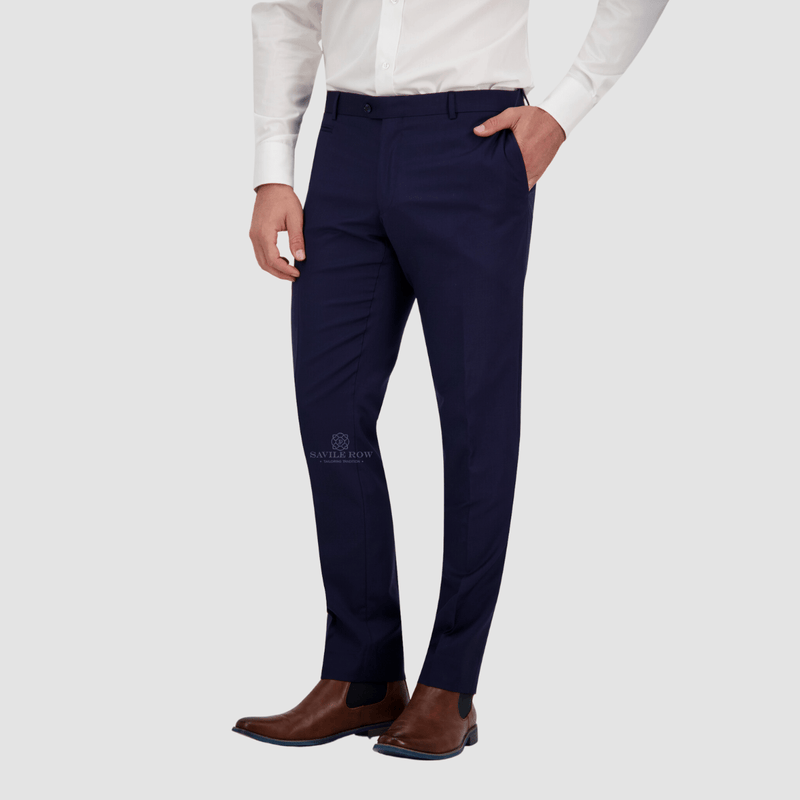 mens slim fit navy suit pants with a tapered leg worn with brown leather shoes