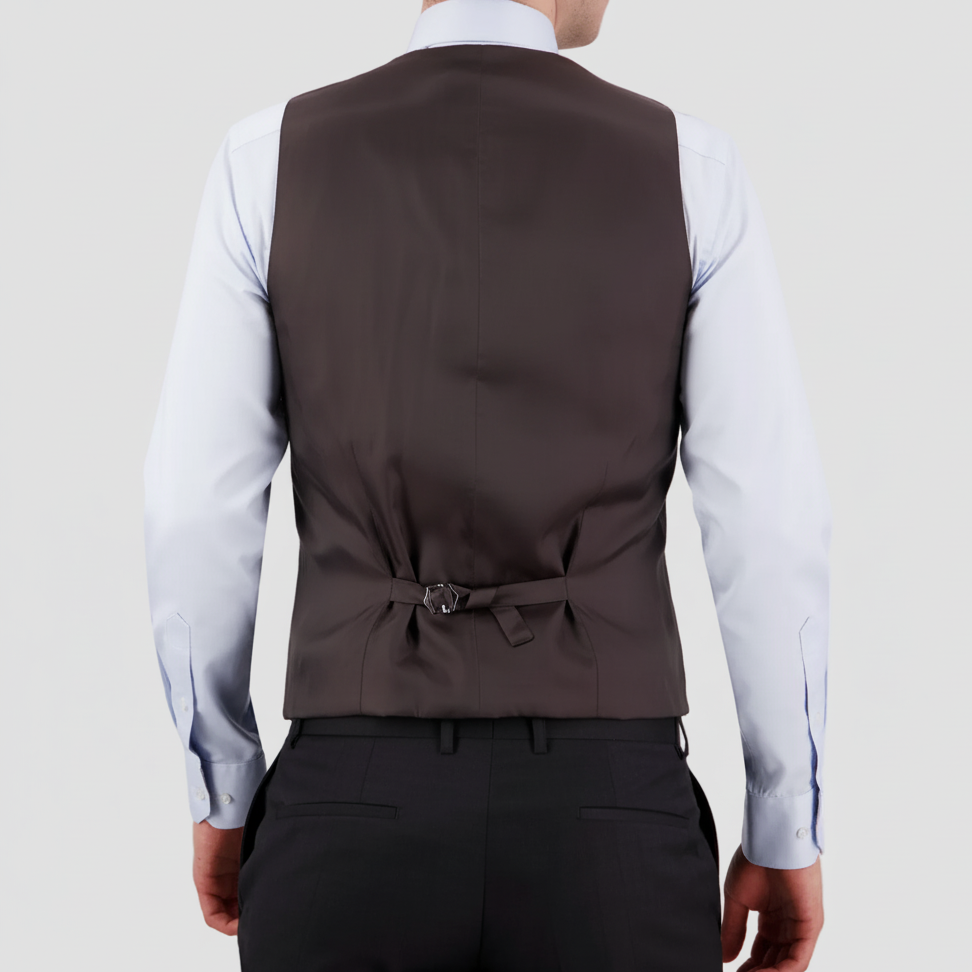 Tailored charcoal travel‑finish wool vest with satin back and an adjustable tab by Savile Row with matching dress pants, light blue shirt and navy tie.