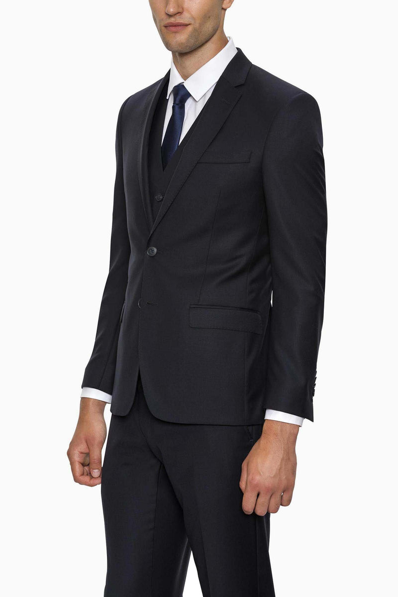 a model wears the gibson breeze suit in navy wool form mens suit warehoue