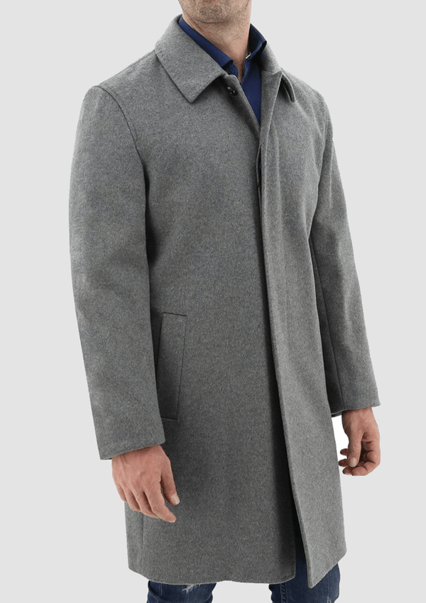 a man wearing a casual weekend look featuring the Daniel Hechter carvell grey cloak winter overcoat  over a navy shirt and blue jeans