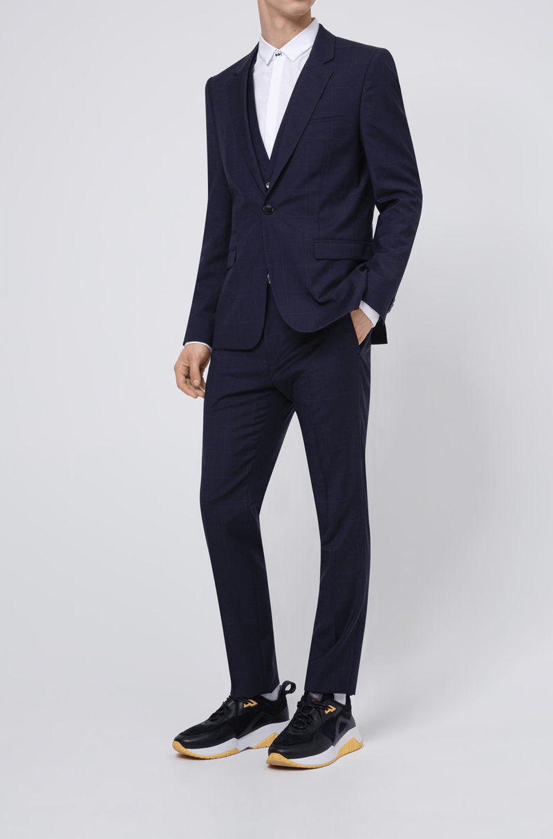 the full length view of the hugo boss mens arti hesten suit jacket in dark navy pure wool a flatlay image of the slim fit arti hesten hugo boss suit trouser in blue pure wool 50427352